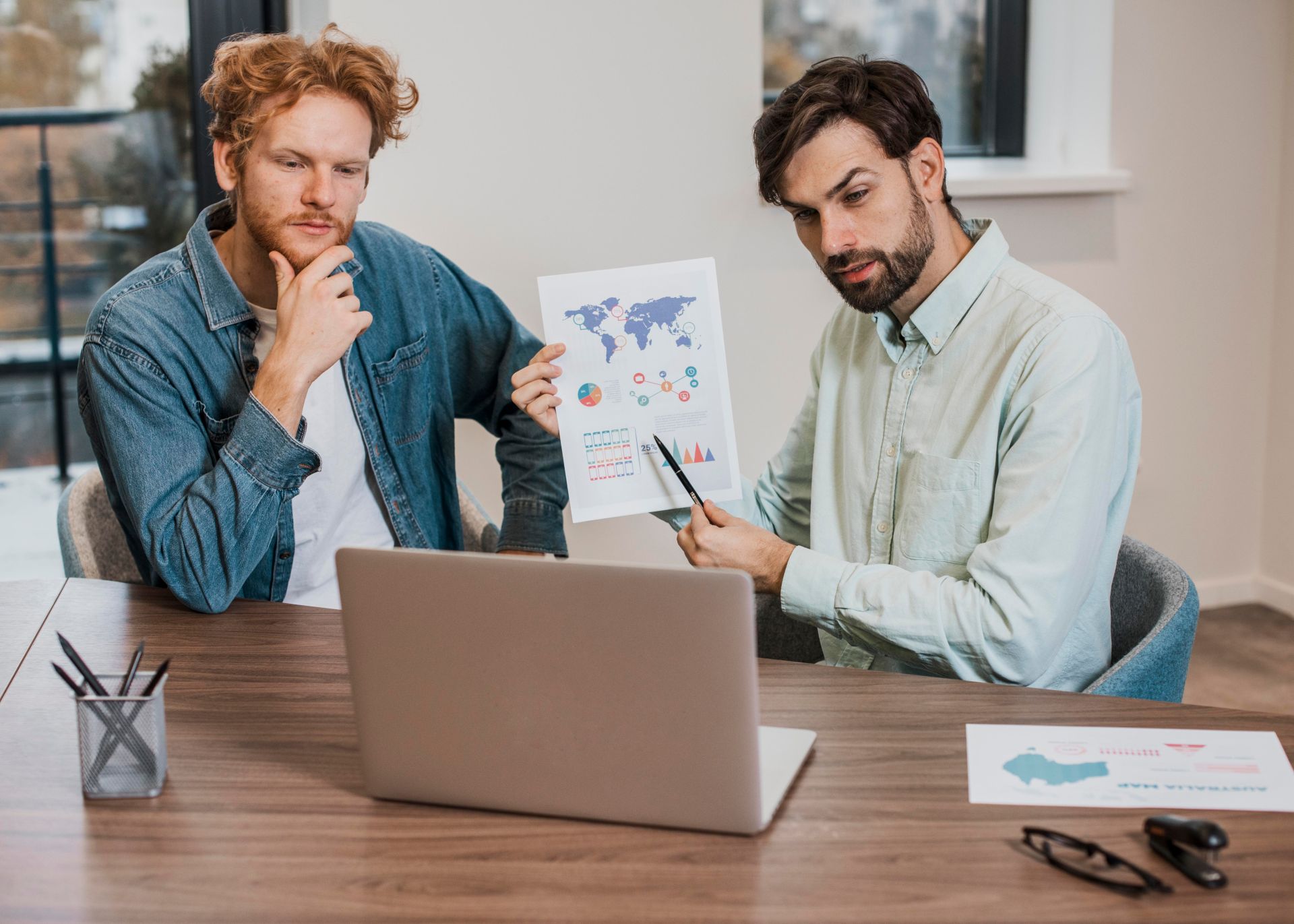 Marketer reviewing AI search results on a laptop